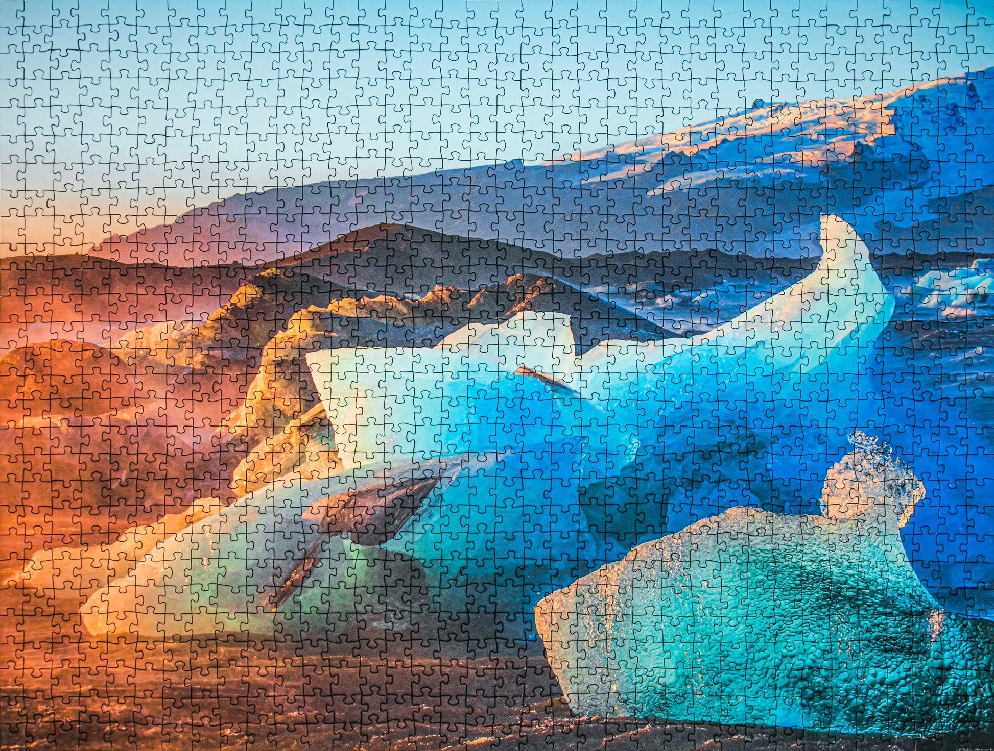 Jigsaw puzzle with a scenic landscape featuring icebergs and mountains.