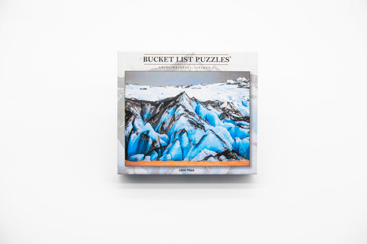 Bucket List Puzzles packaging with a mountain puzzle image on a white background