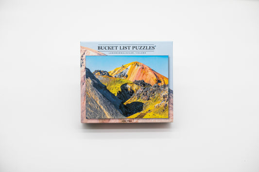 Bucket List Puzzles packaging with a mountain image on a white background