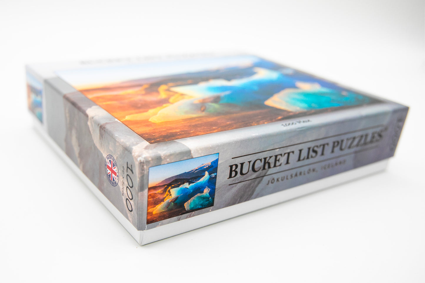Box of Bucket List Puzzles with scenic images on a white background