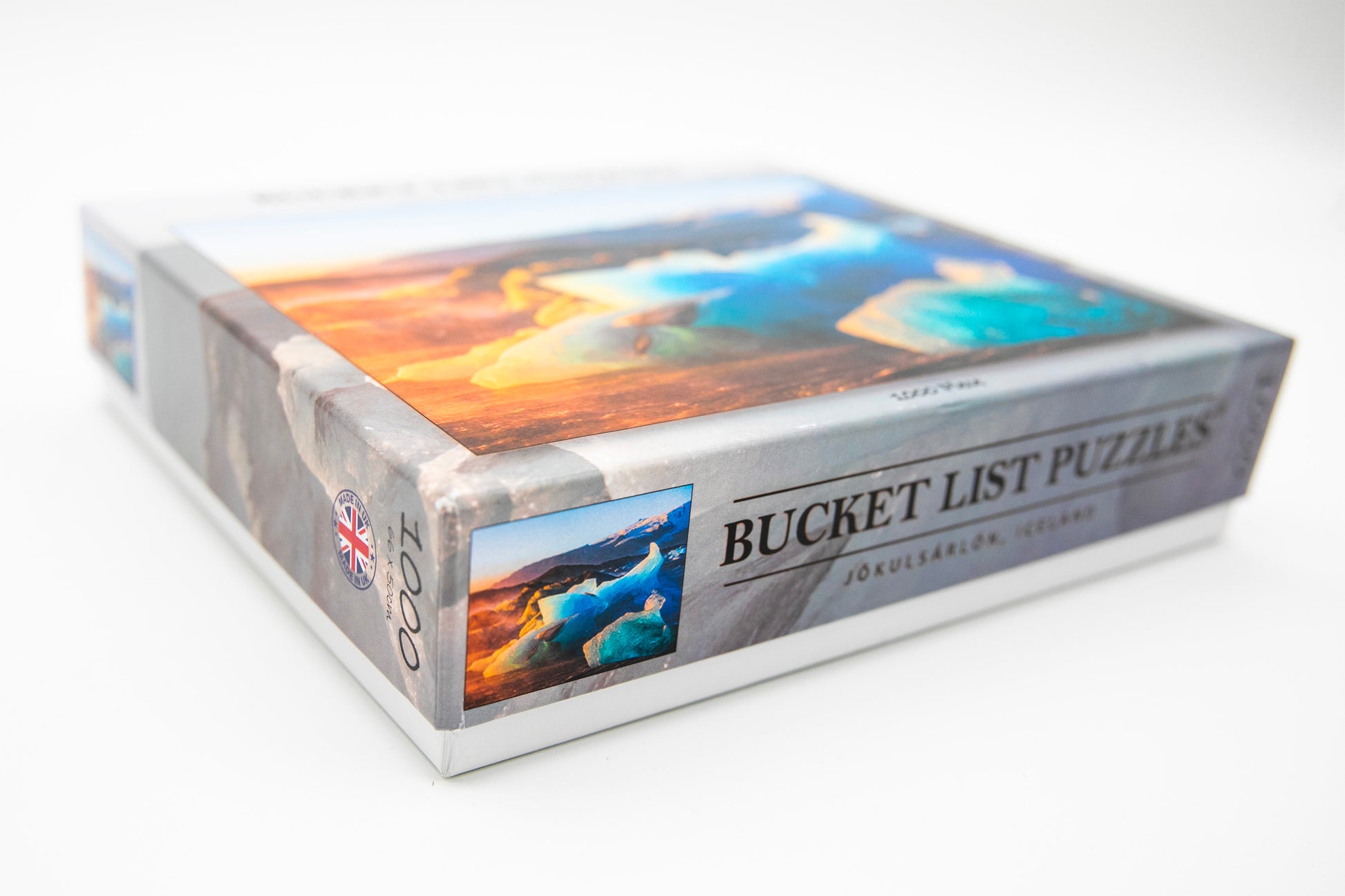 Box of Bucket List Puzzles with scenic images on a white background
