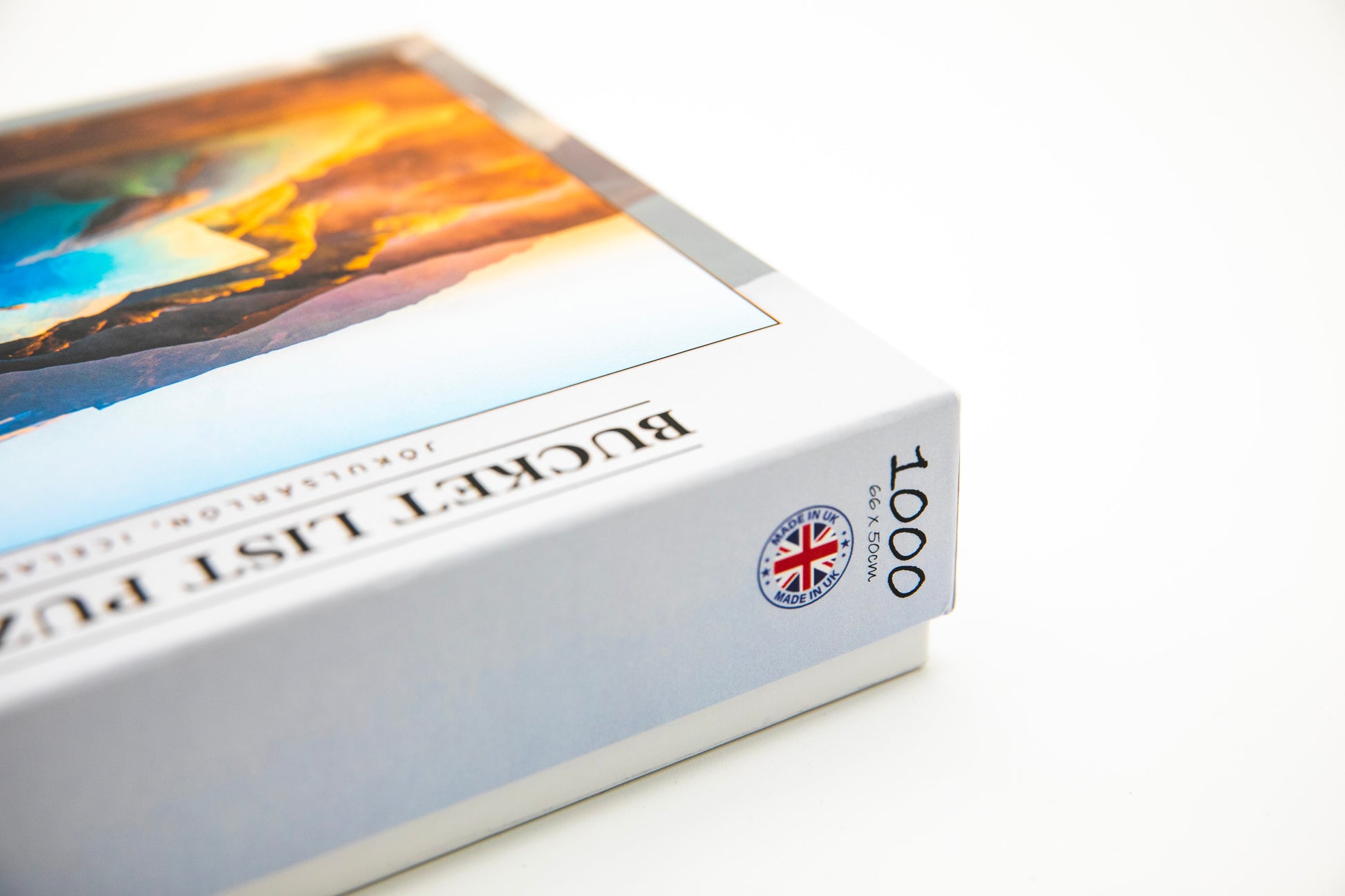 Jigsaw puzzle box with a scenic image on the cover and a visible brand logo.