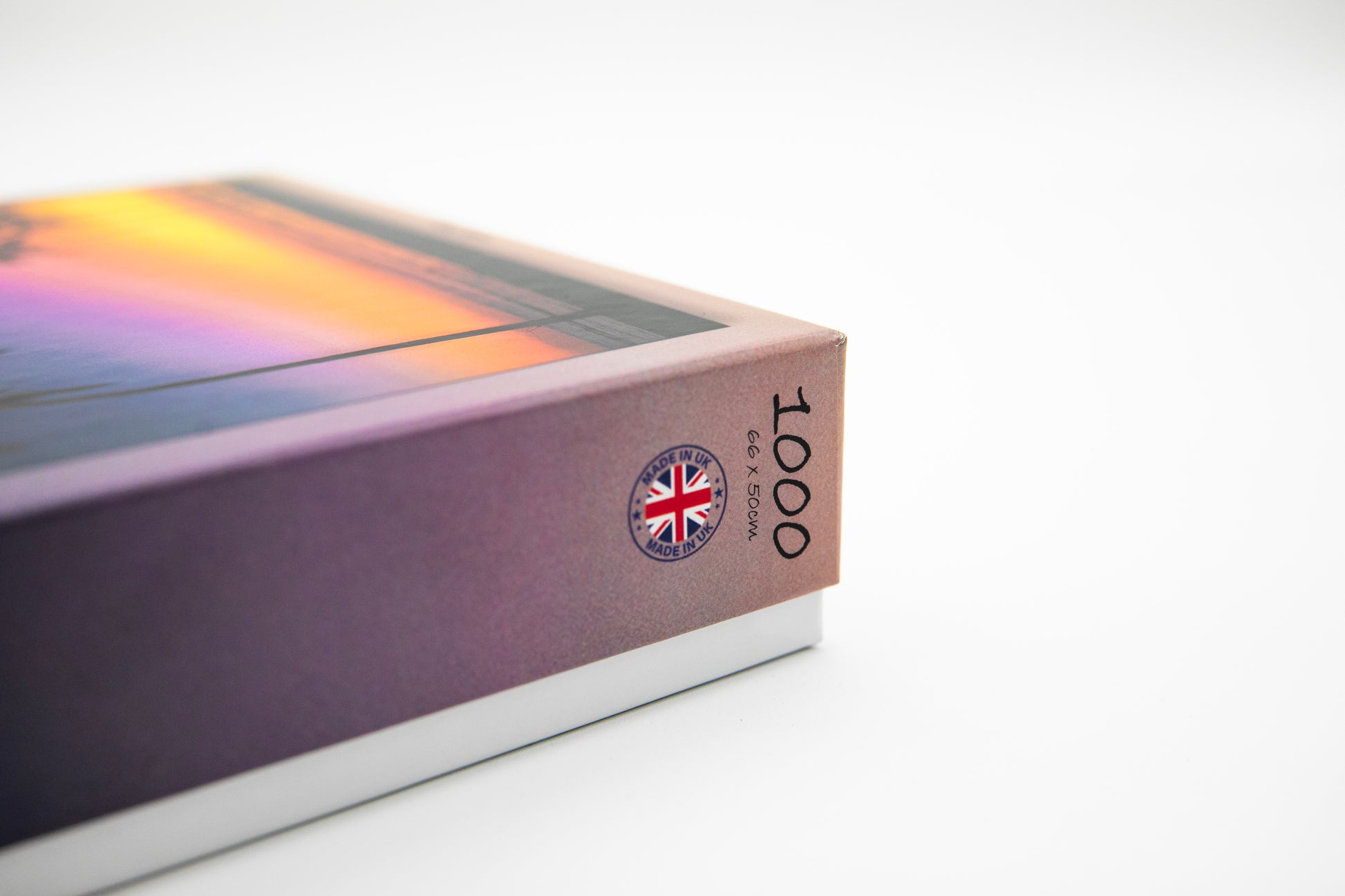 Close-up of a book with a Union Jack design and '1000' on a white background